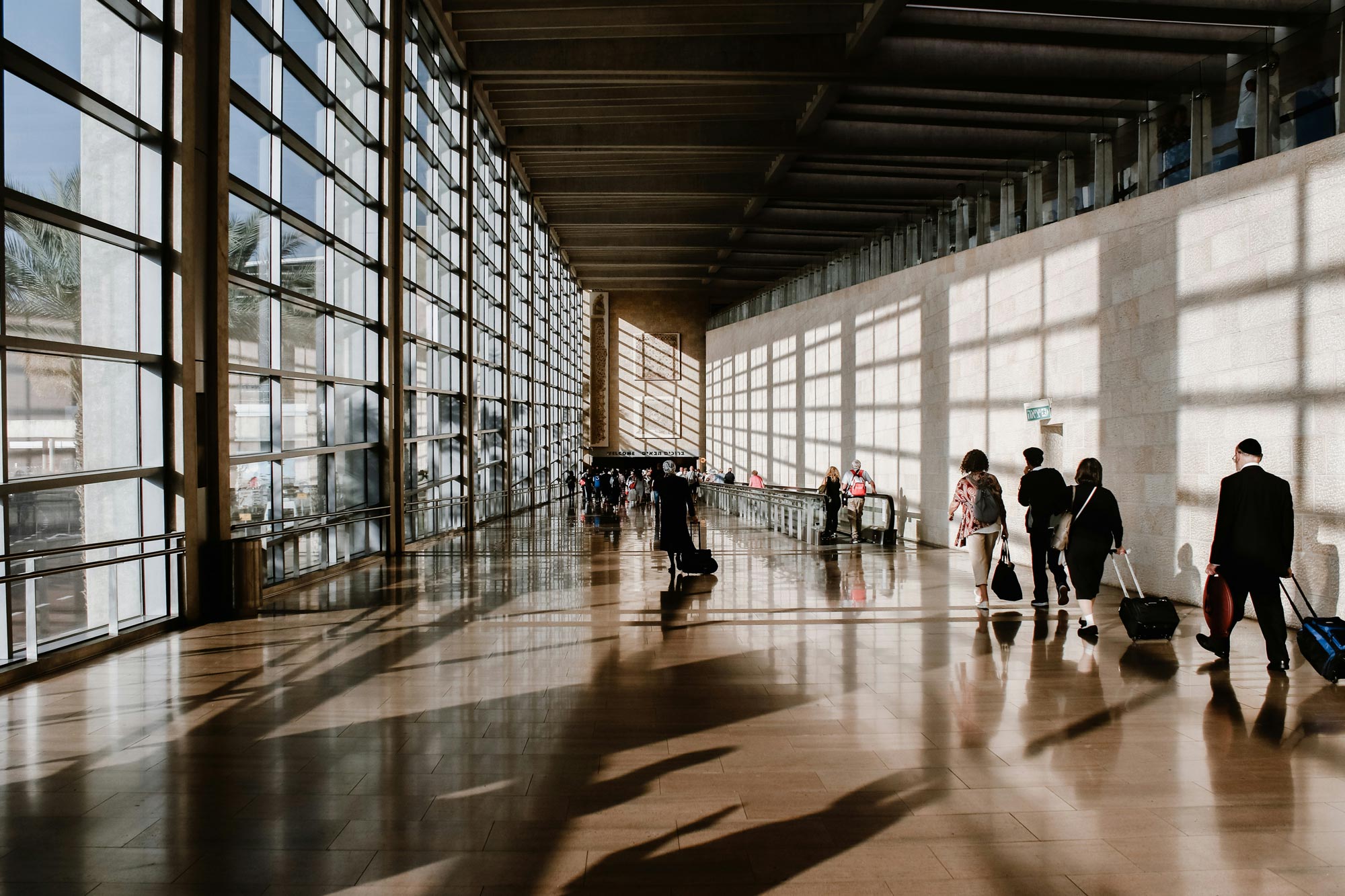 People walking with suitcases